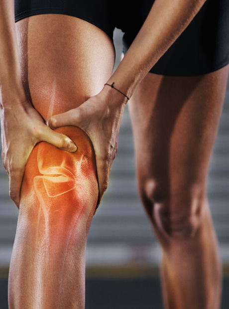 Person holding knee with joint pain